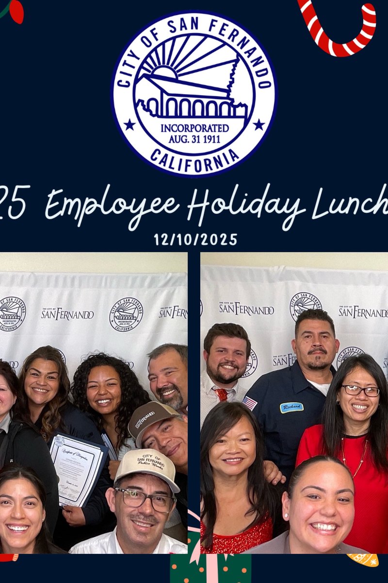 Employees at a company holiday luncheon photo booth